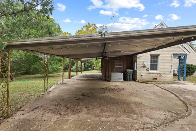 a view of a room with gym equipment and a large window