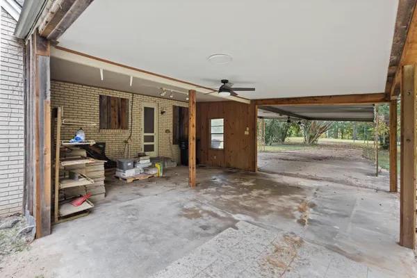 a backyard of a house with a tree