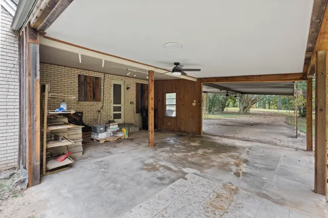 a backyard of a house with a tree