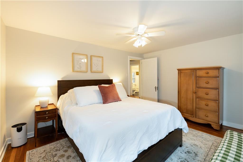 111 Sycamore Drive Pittsburgh, PA 15237 - Photo 17 of 24 a bedroom with a bed and a chandelier