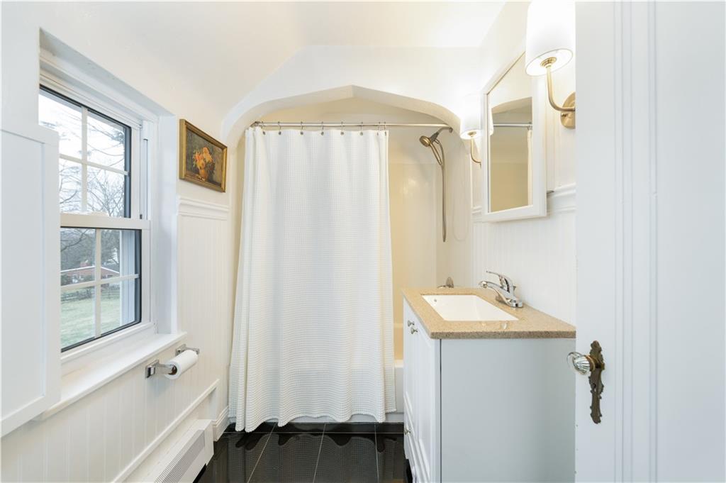 111 Sycamore Drive Pittsburgh, PA 15237 - Photo 20 of 24 a bathroom with a sink and a mirror