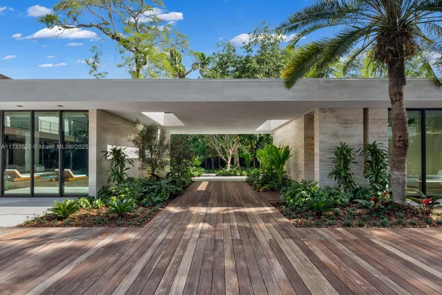 front view of a house with a garden