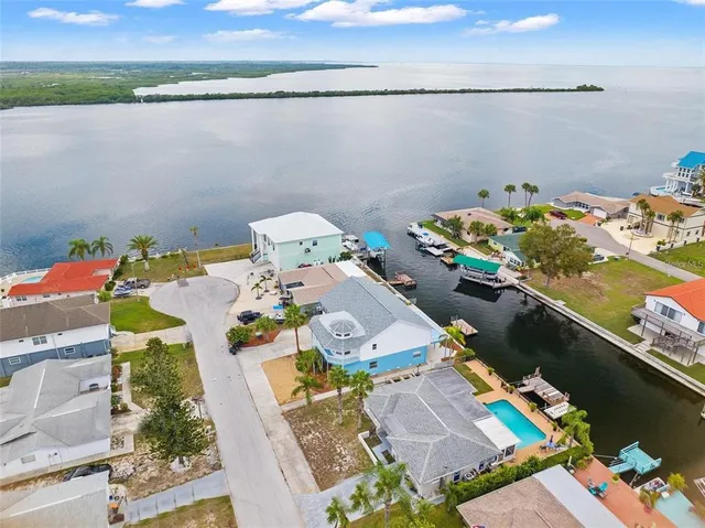 an aerial view of a house with a ocean view