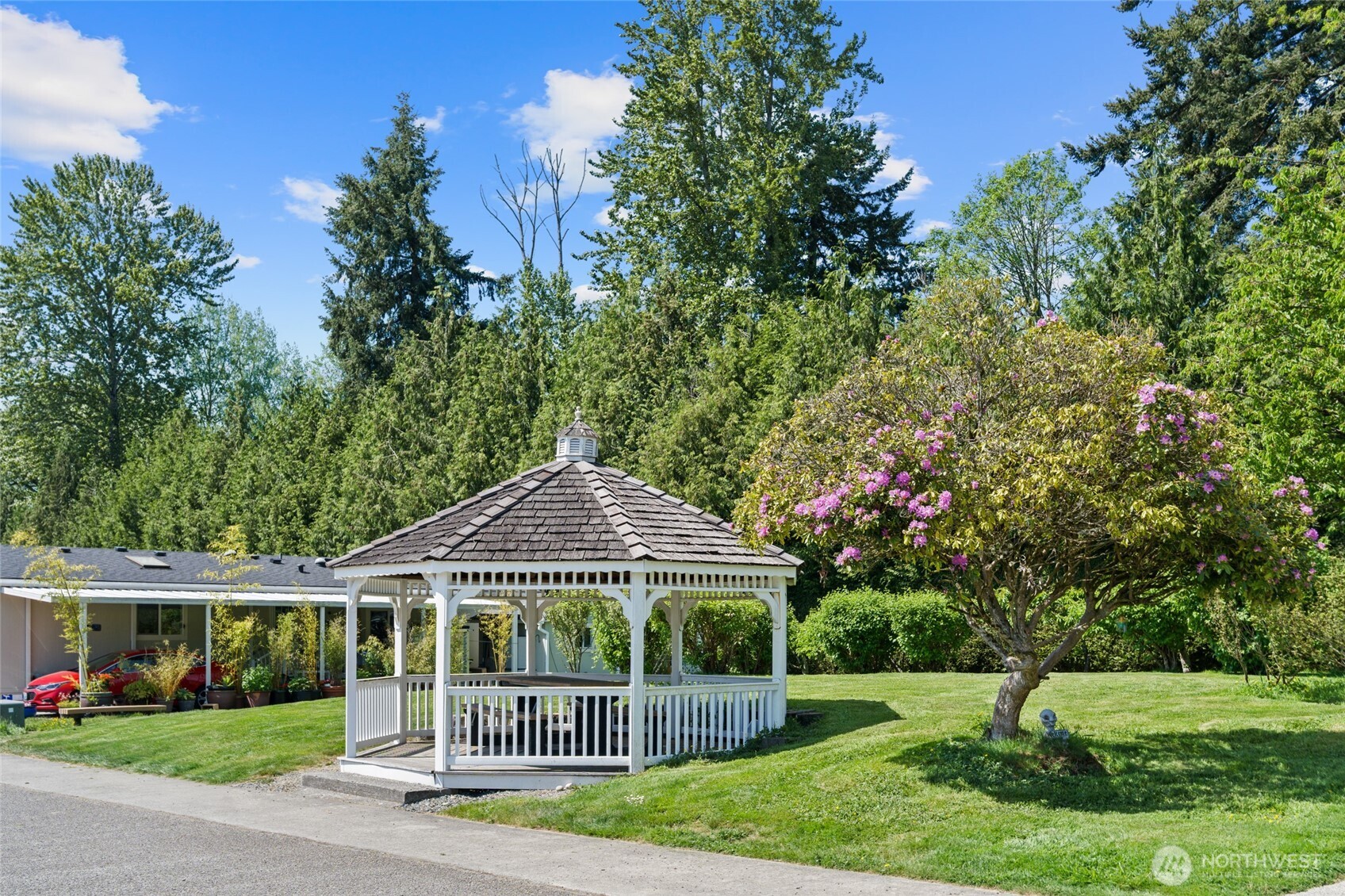 23825 15th Avenue Southeast, Unit 108 Bothell, WA 98021 - Photo 37 of 39 a front view of a house with a garden