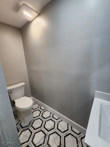 a bathroom with a toilet and a sink