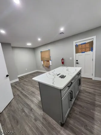 a kitchen with a stove and a refrigerator