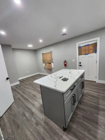 a kitchen with a stove and a refrigerator