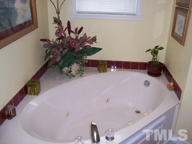 3370 Green Road Spring Hope, NC 27882 - Photo 14 of 25 a bathroom with a tub