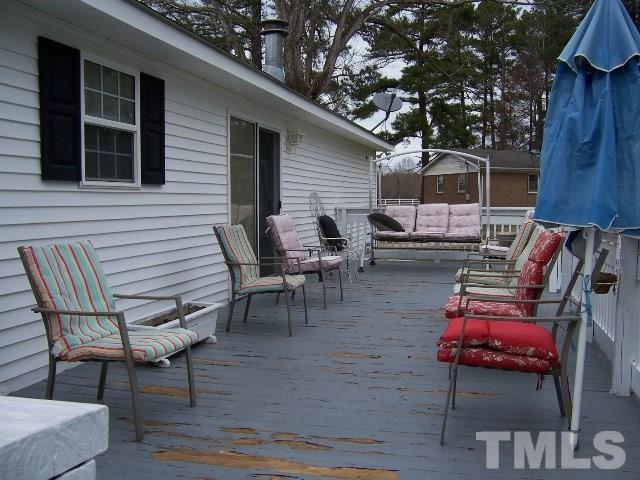 3370 Green Road Spring Hope, NC 27882 - Photo 22 of 25 a backyard of a house with wooden floor and outdoor seating