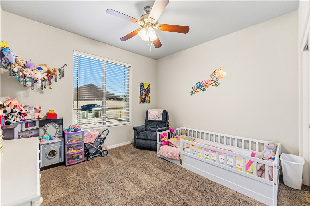 4143 North Stampede Road Kingman, AZ 86401 - Photo 23 of 42 Neutral wall tones with a window featuring blinds