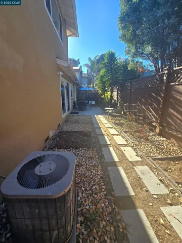 a view of a backyard with table and chairs