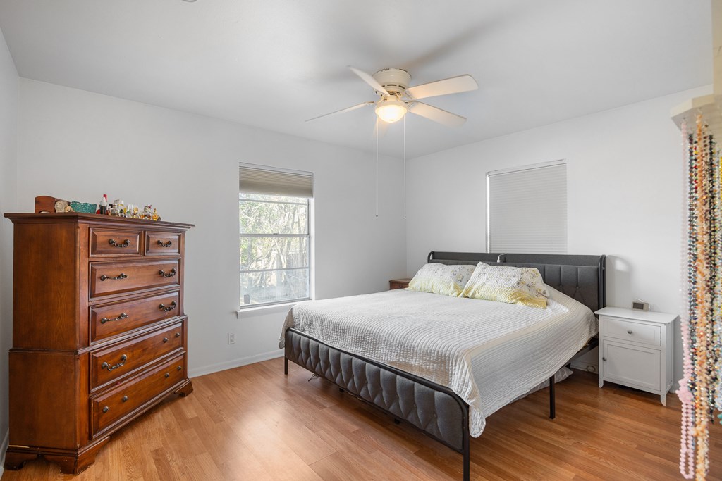 608 Rees Street Kerrville, TX 78028 - Photo 11 of 17 a bedroom with a bed and a window