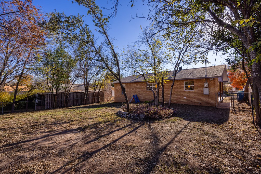 608 Rees Street Kerrville, TX 78028 - Photo 14 of 17 a view of a house with a yard covered with snow