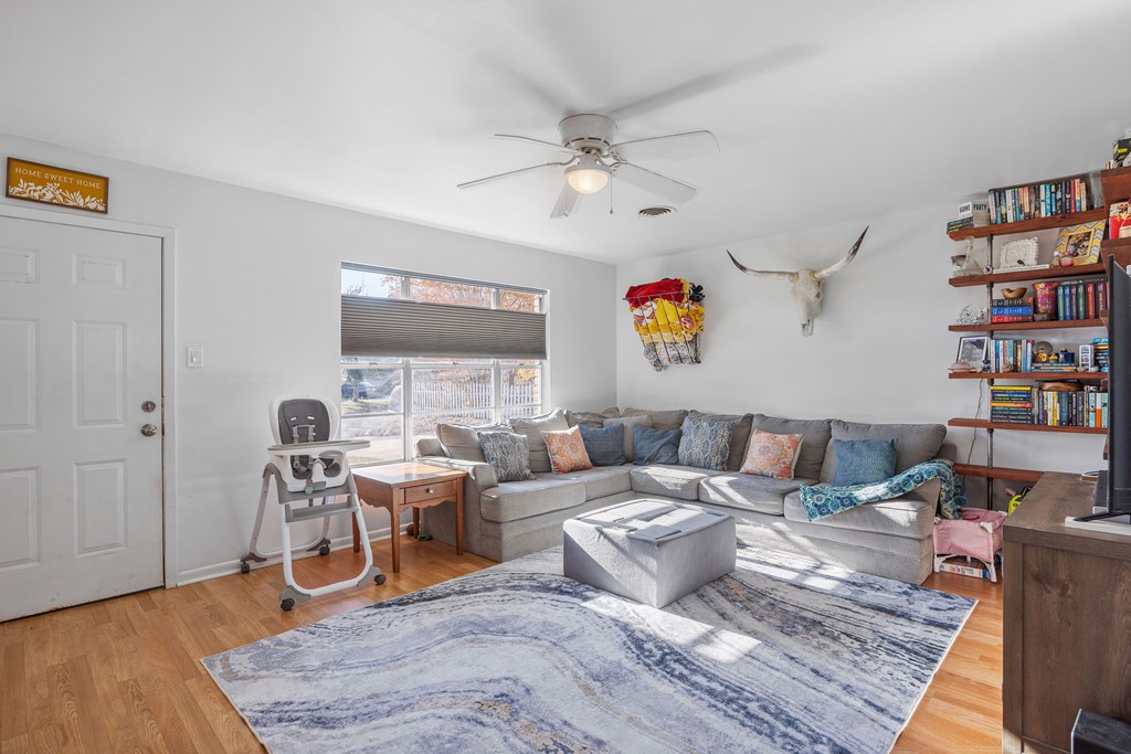 608 Rees Street Kerrville, TX 78028 - Photo 3 of 17 a living room with furniture and a wooden floor