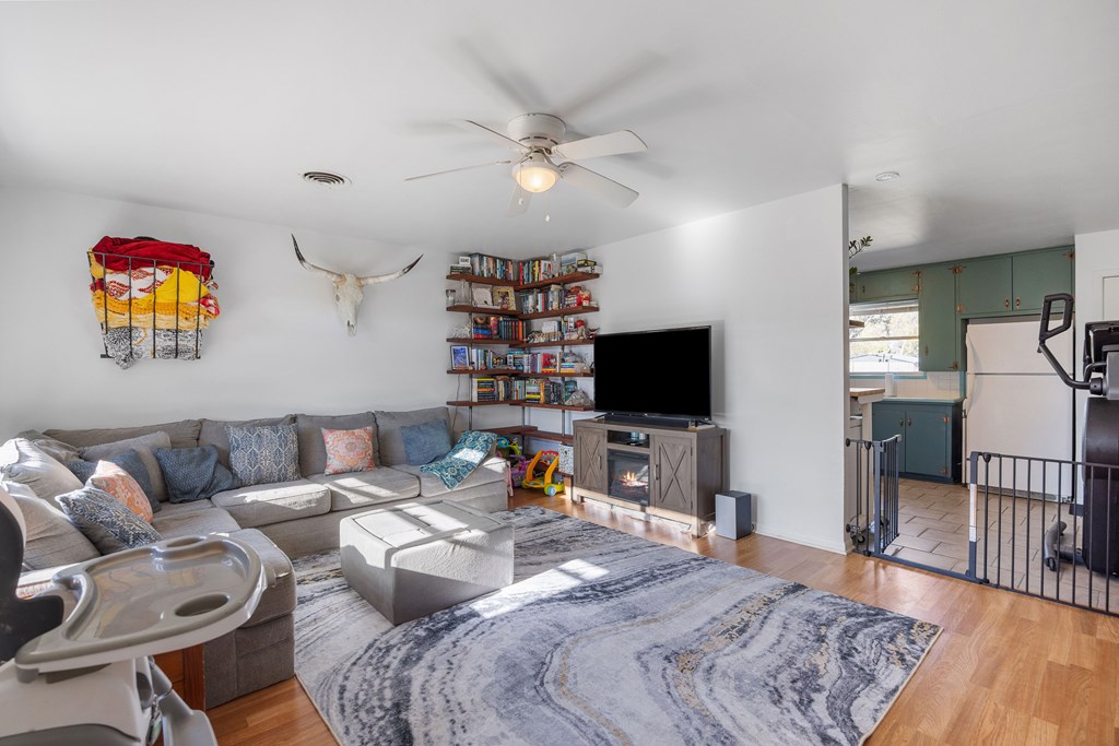 608 Rees Street Kerrville, TX 78028 - Photo 4 of 17 a bedroom with a bed and a flat screen tv