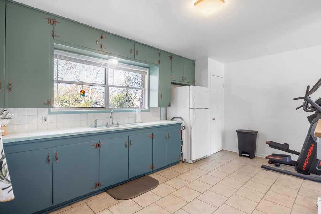 608 Rees Street Kerrville, TX 78028 - Photo 8 of 17 a spacious bathroom with a double vanity sink and a mirror