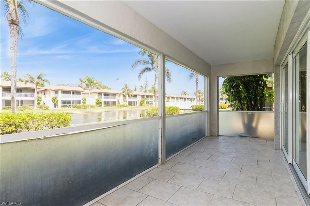 1155 Sandpiper Street, Unit B3 Naples, FL 34102 - Photo 20 of 21 Unfurnished sunroom with a water view