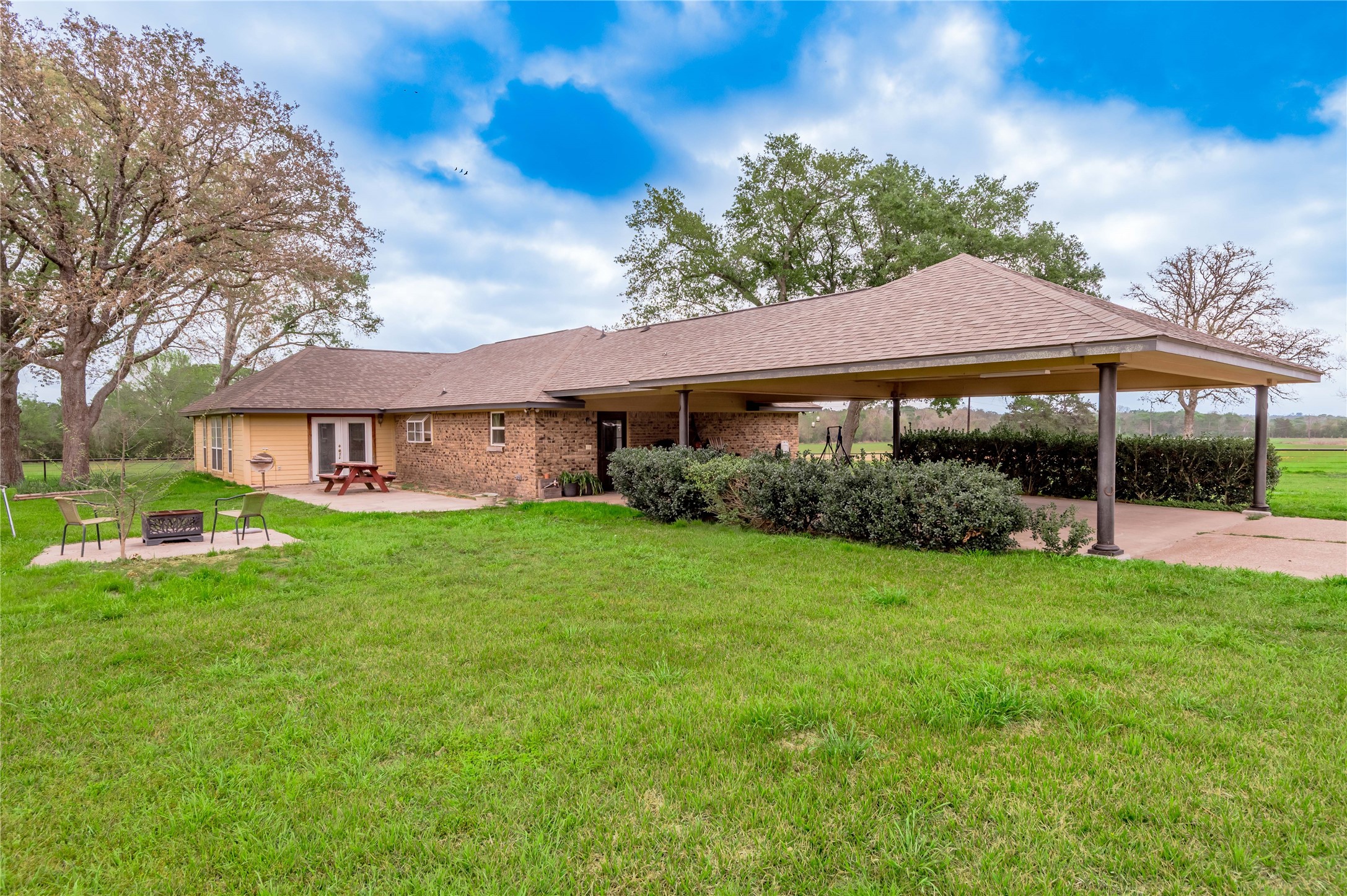 758 Wire Road Huntsville, TX 77320 - Photo 27 of 44 a front view of a house with garden
