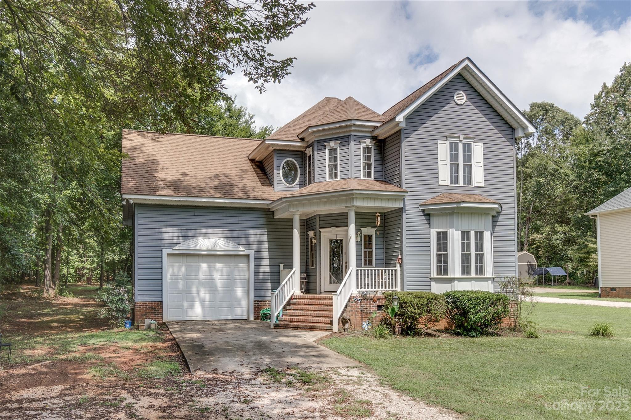 2070 Smithford Road Hickory Grove, SC 29717 - Photo 1 of 39 a front view of a house with a yard