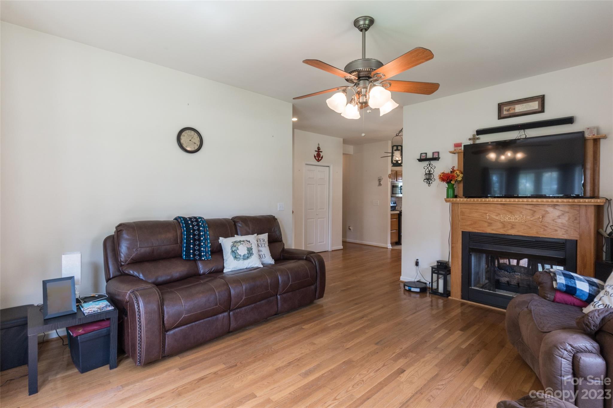 2070 Smithford Road Hickory Grove, SC 29717 - Photo 13 of 39 a living room with furniture a fireplace and a flat screen tv