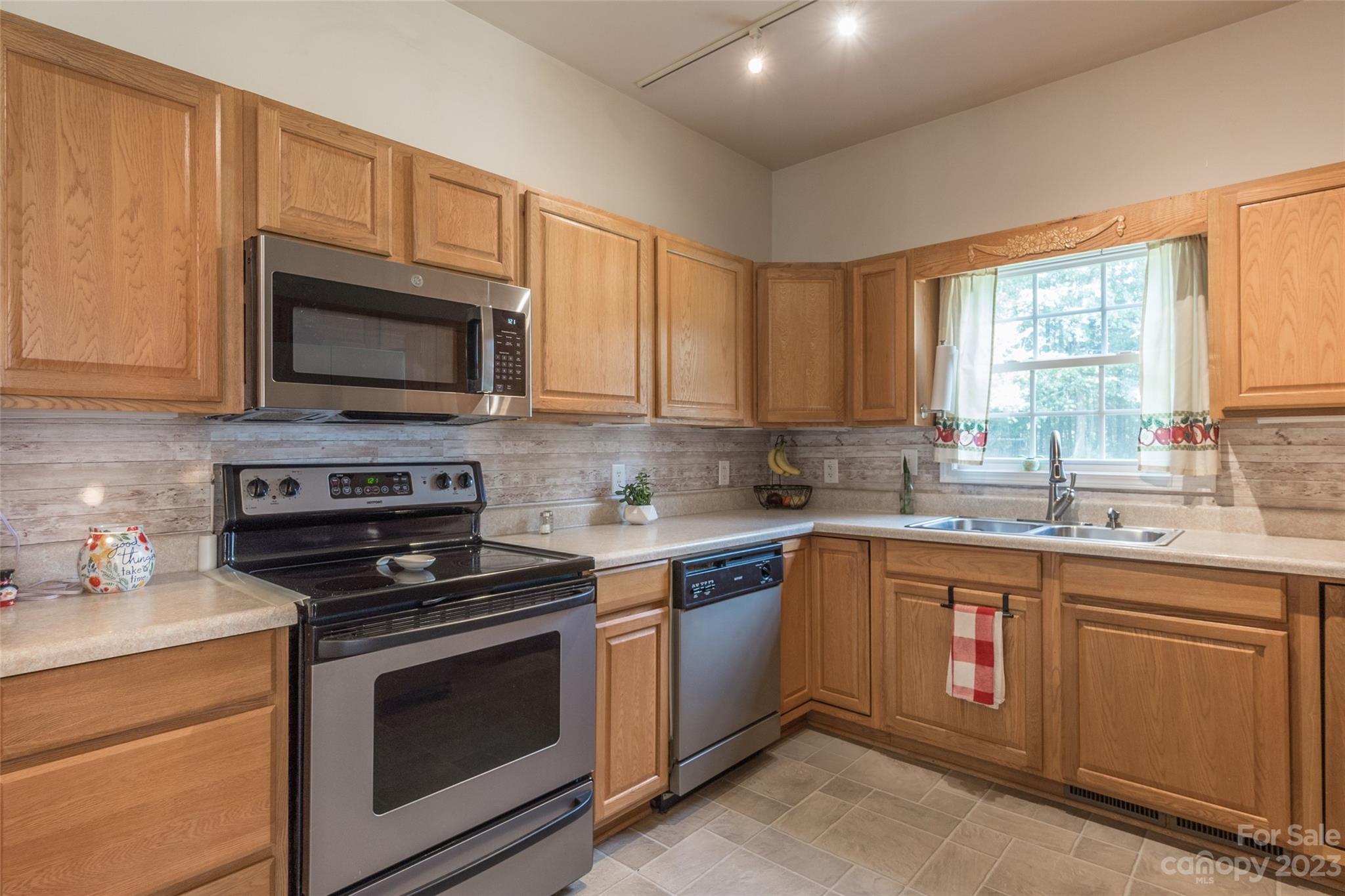2070 Smithford Road Hickory Grove, SC 29717 - Photo 17 of 39 a kitchen with cabinets appliances a sink and a window