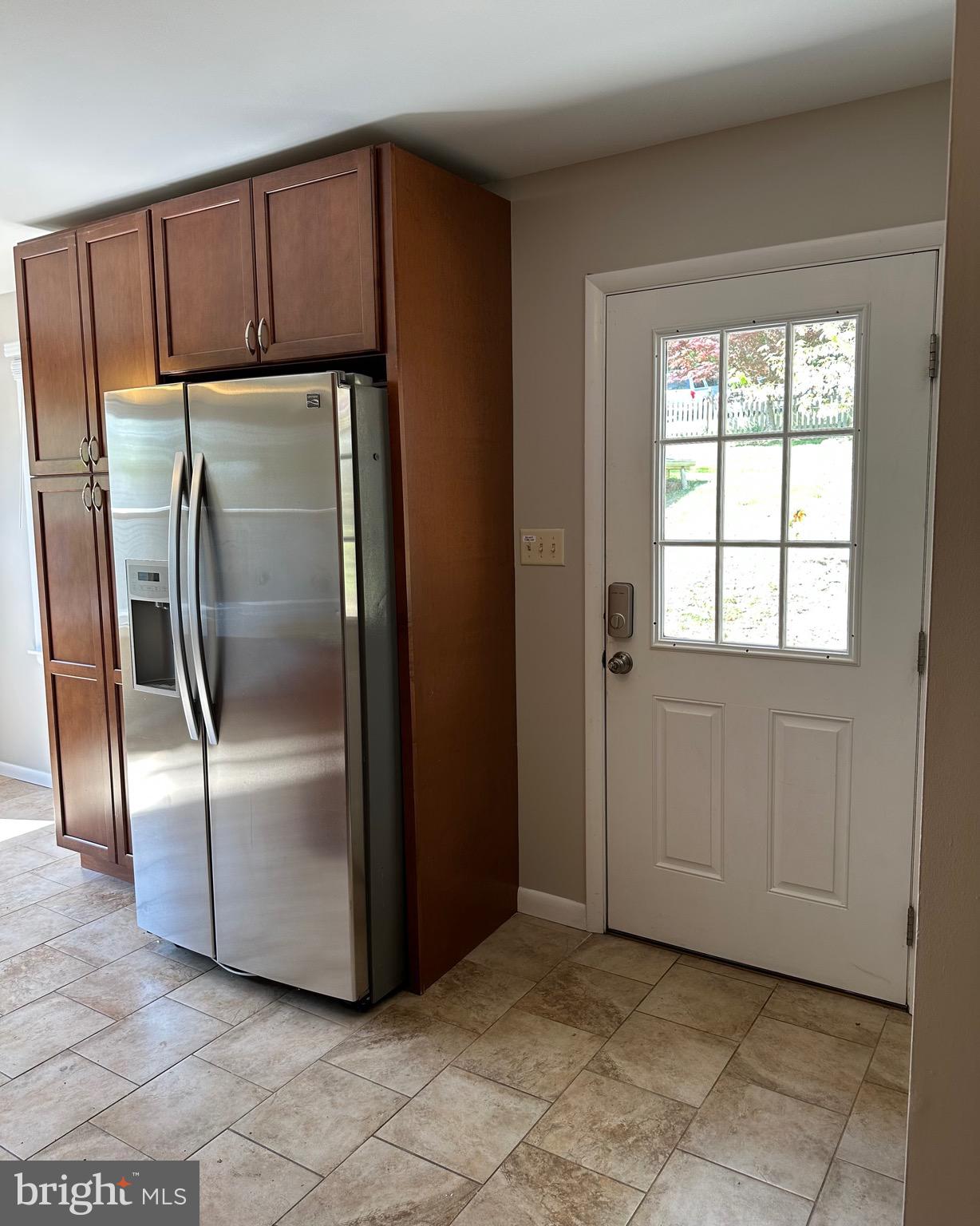 6020 Hanover Road Hanover, MD 21076 - Photo 20 of 42 a metallic refrigerator freezer sitting in a kitchen