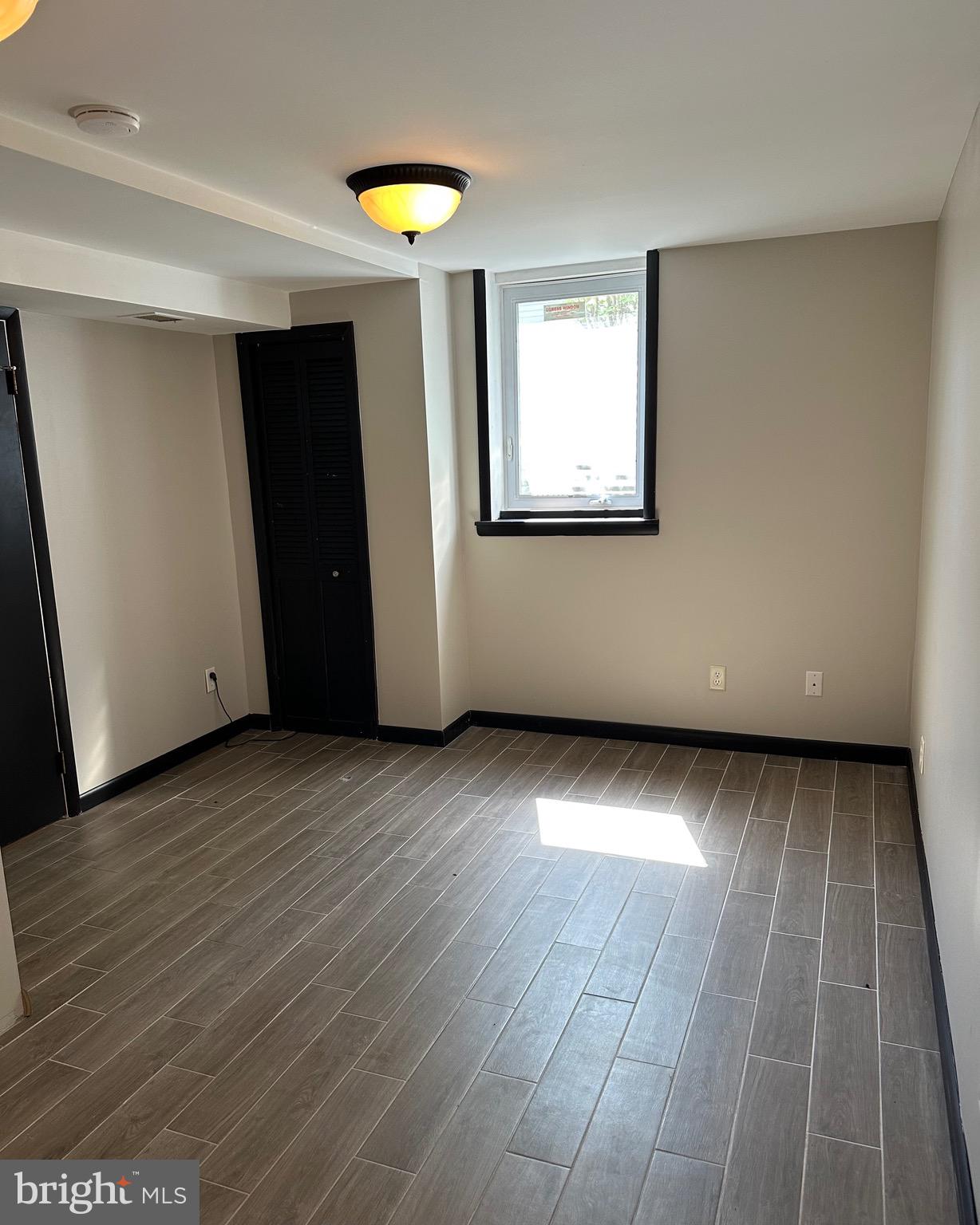 6020 Hanover Road Hanover, MD 21076 - Photo 29 of 42 an empty room with wooden floor and windows