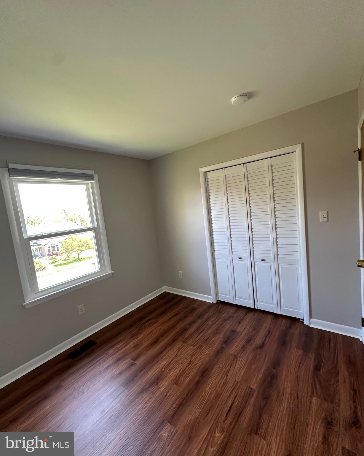 6020 Hanover Road Hanover, MD 21076 - Photo 35 of 42 an empty room with wooden floor and windows