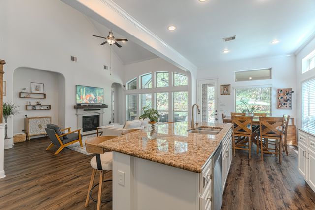 a bathroom with a double vanity sink a mirror and a bathtub