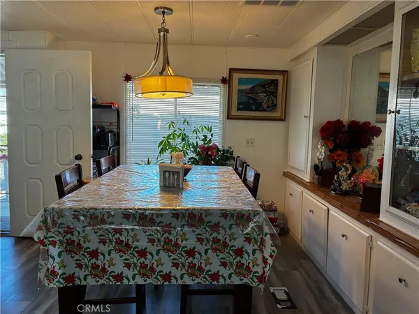 a kitchen with stainless steel appliances a sink stove and cabinets