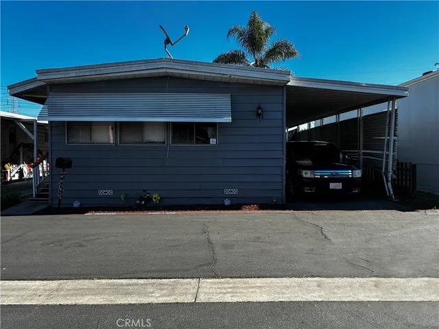 a car parked in parking area of a house