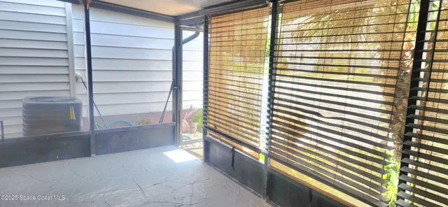 a view of a room with a large window