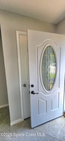a close view of a utility room with washer and dryer