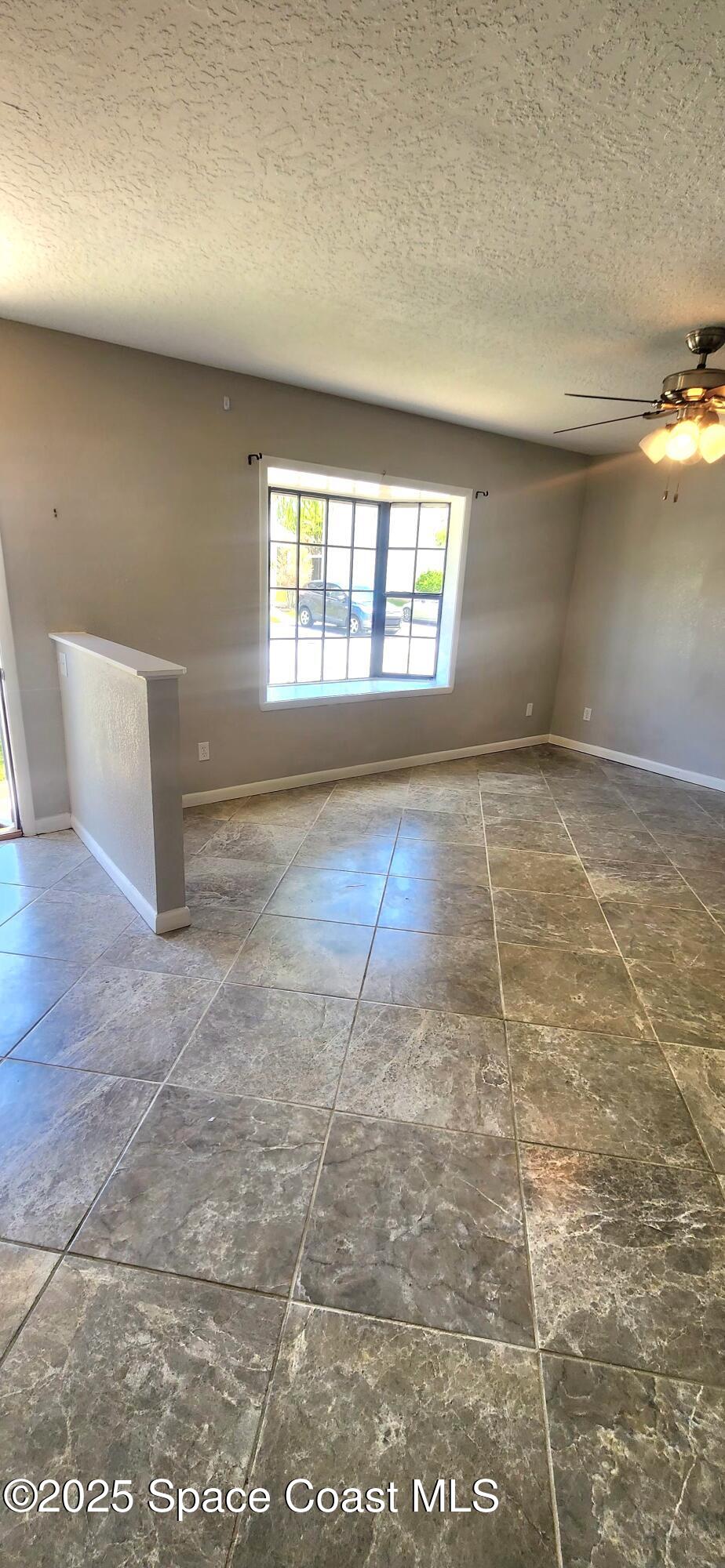 2014 Manor Drive Northeast Palm Bay, FL 32905 - Photo 4 of 24 en empty room with windows