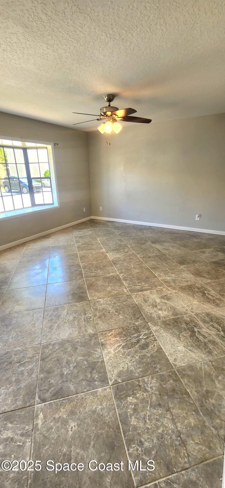 2014 Manor Drive Northeast Palm Bay, FL 32905 - Photo 6 of 24 en empty room with windows