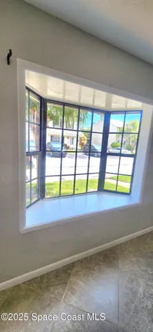 a view of an empty room and window