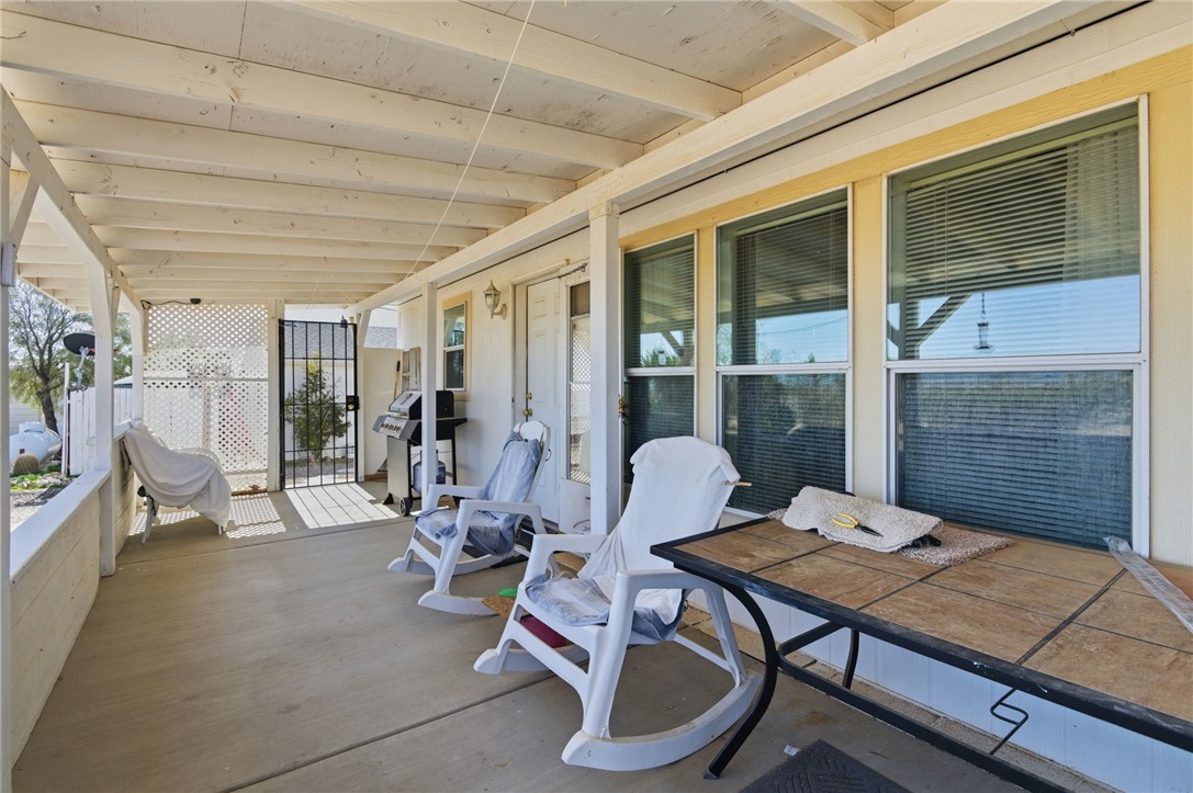 4342 Cordes Road Golden Valley, AZ 86413 - Photo 36 of 39 a view of a patio with couple of chairs and potted plants