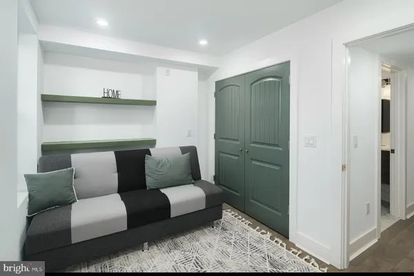 a living room with furniture and a rug