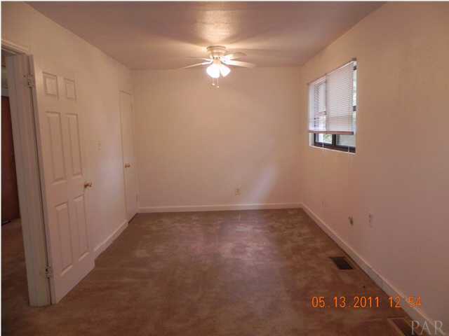 204 Alton Road Pensacola, FL 32507 - Photo 13 of 21 Another view of Master Bedroom from the other end. You can view the Beautiful Lake from the windows on the right.