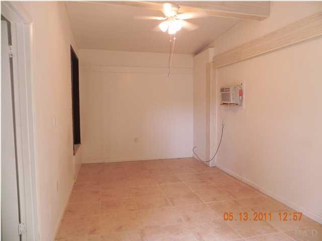 204 Alton Road Pensacola, FL 32507 - Photo 14 of 21 Additional Big Bedroom with Tiles and seperate A/C unit. Closet space is to your left.