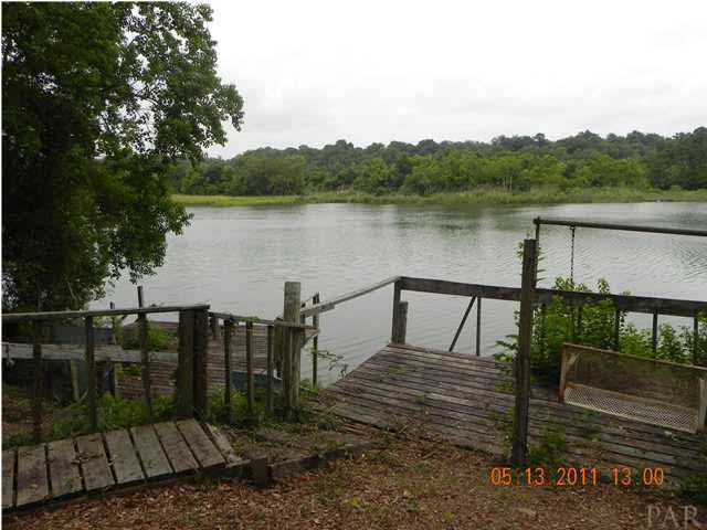 204 Alton Road Pensacola, FL 32507 - Photo 18 of 21 Looking at the Lake from the side of the Wooden Walkway.