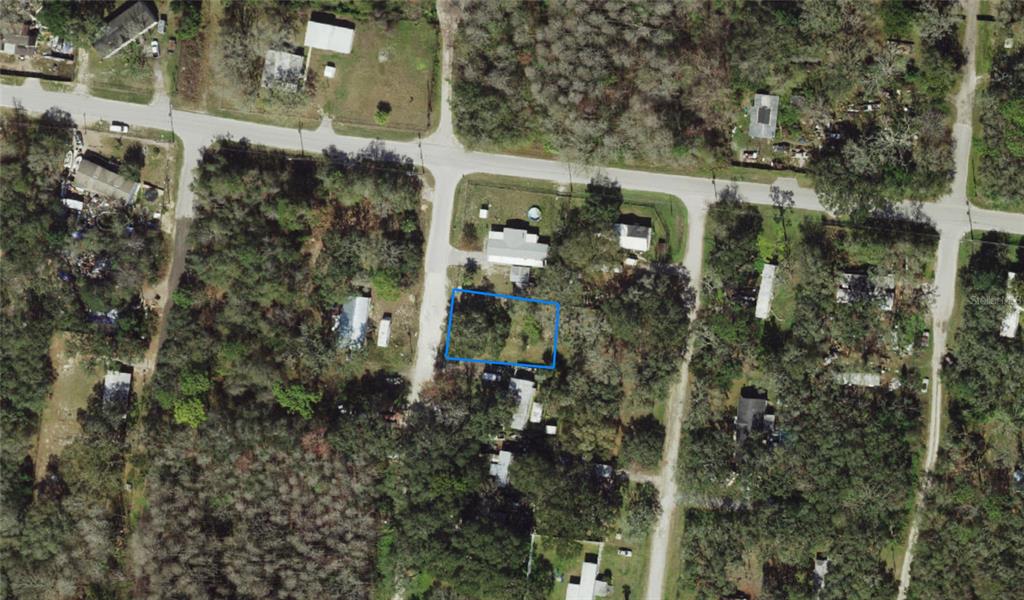 16 Jungle Street New Port Richey, FL 34654 - Photo 2 of 3 an aerial view of a house with a tree