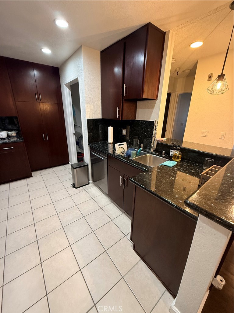 14630 Dickens Street, Unit 307 Sherman Oaks, CA 91403 - Photo 12 of 41 a kitchen with a sink cabinets and appliances