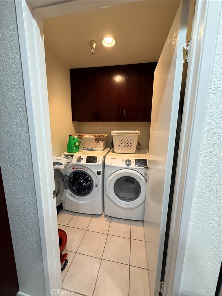 14630 Dickens Street, Unit 307 Sherman Oaks, CA 91403 - Photo 16 of 41 a view of a storage and utility room with washer and dryer