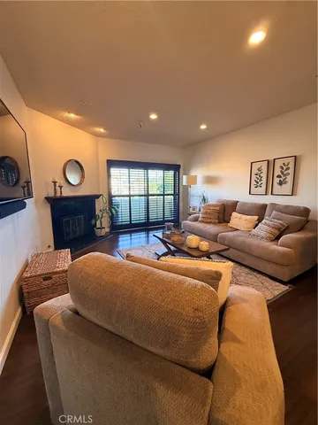 a view of a living room and a balcony
