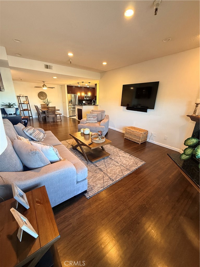 14630 Dickens Street, Unit 307 Sherman Oaks, CA 91403 - Photo 19 of 41 a living room with furniture and a flat screen tv