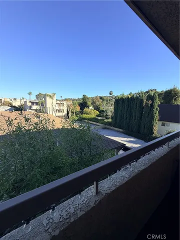 a bedroom with a bed and a mirror