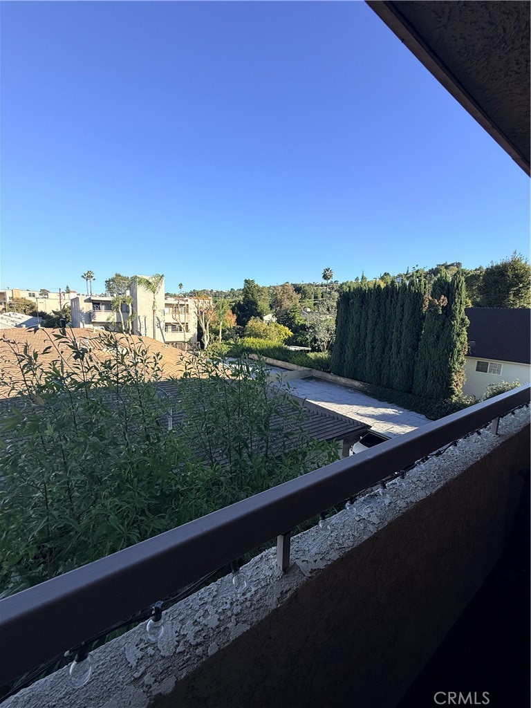 14630 Dickens Street, Unit 307 Sherman Oaks, CA 91403 - Photo 23 of 41 a view of a balcony with an outdoor seating and mountain view