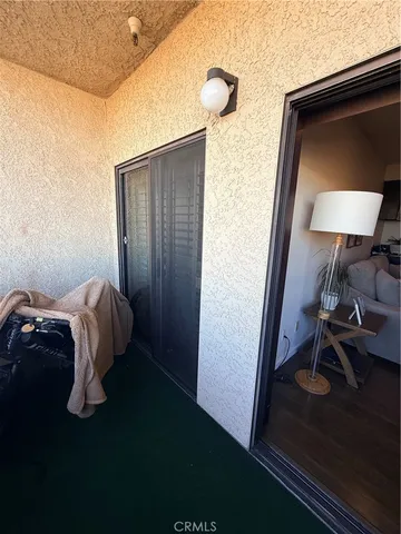 a bedroom with a bed and flat screen tv