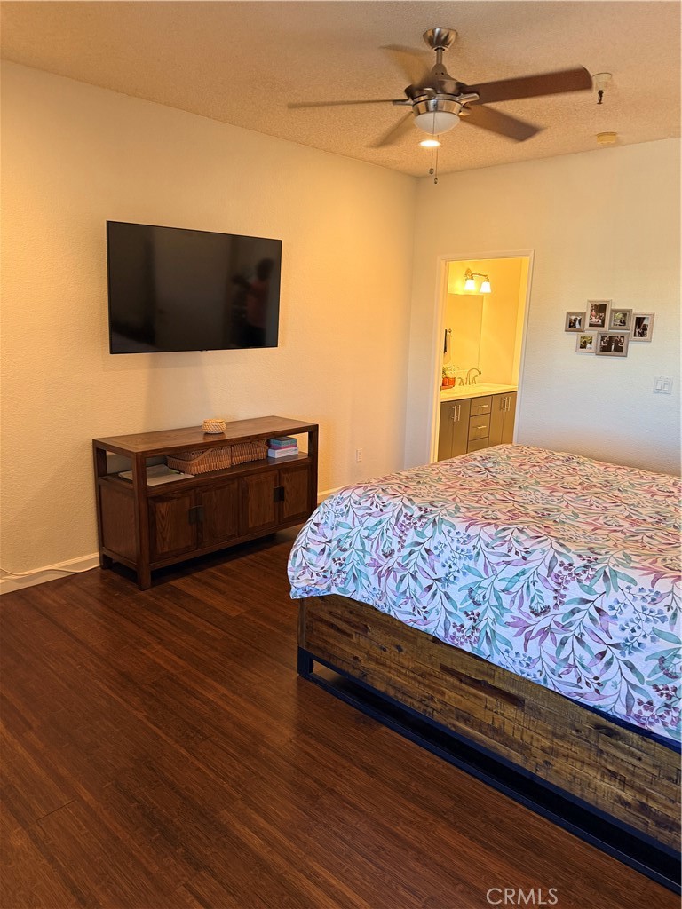 14630 Dickens Street, Unit 307 Sherman Oaks, CA 91403 - Photo 29 of 41 a bedroom with a bed and flat screen tv